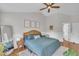 Spacious main bedroom with hardwood floors, a ceiling fan, and stylish decor at 1905 Indianwood Ct, Raleigh, NC 27604
