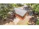 Aerial view of the backyard and back exterior of the home, surrounded by mature trees at 2005 Cole Mill Rd, Durham, NC 27712