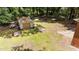 Aerial view of backyard featuring detached garage, mature trees, and fenced perimeter at 2005 Cole Mill Rd, Durham, NC 27712