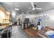 Spacious basement features a ceiling fan, multiple seating areas, and a convenient kitchenette setup at 2005 Cole Mill Rd, Durham, NC 27712