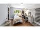 Bedroom with hardwood floors, a desk, and a closet at 2005 Cole Mill Rd, Durham, NC 27712