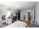 Bedroom features hardwood floors, a desk, and an open closet at 2005 Cole Mill Rd, Durham, NC 27712