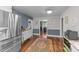 Spacious kitchen featuring stainless steel refrigerator and a view into the cozy living room at 2005 Cole Mill Rd, Durham, NC 27712