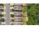 Aerial view of rooftops in a residential neighborhood, showcasing well-kept yards and street parking at 2057 Tanners Mill Dr, Durham, NC 27703