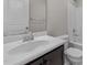 Bathroom featuring a dark wood vanity with chrome fixtures and a tub/shower combo at 2057 Tanners Mill Dr, Durham, NC 27703