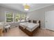 Cozy bedroom with natural light, neutral tones, and a relaxing atmosphere at 2057 Tanners Mill Dr, Durham, NC 27703
