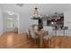 Open dining area with wood floors connecting to the kitchen and living space at 2057 Tanners Mill Dr, Durham, NC 27703