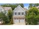 Charming home featuring stone accents, a two-car garage, and beautiful landscaping at 2057 Tanners Mill Dr, Durham, NC 27703