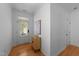 Bright entryway featuring hardwood floors and an accent cabinet at 2057 Tanners Mill Dr, Durham, NC 27703