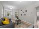 Comfortable living room features a seating area, with view into bedroom at 2057 Tanners Mill Dr, Durham, NC 27703