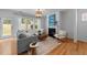 Cozy living room with a fireplace, hardwood floors, and natural light at 2057 Tanners Mill Dr, Durham, NC 27703