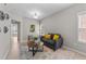 Inviting living room with comfortable seating, stylish decor, and plenty of natural light at 2057 Tanners Mill Dr, Durham, NC 27703