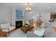 Open-concept living space with a fireplace and connection to the dining area at 2057 Tanners Mill Dr, Durham, NC 27703