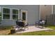 Outdoor patio with furniture, surrounded by grass and the exterior of the home at 2057 Tanners Mill Dr, Durham, NC 27703
