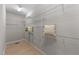 Walk-in closet featuring open shelving for optimal storage and light wood floors at 2057 Tanners Mill Dr, Durham, NC 27703