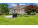 Well-maintained backyard featuring mature landscaping, hardscape patio and grilling area at 206 W Stoneybrook Ct, Benson, NC 27504