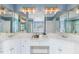Bright bathroom with double vanity and mirrors plus a separate shower and tub at 206 W Stoneybrook Ct, Benson, NC 27504