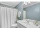 Updated bathroom featuring a shower and tub, vanity with white cabinets, and neutral paint at 206 W Stoneybrook Ct, Benson, NC 27504