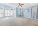 Spacious bedroom with carpet, ceiling fan, and multiple windows allowing for lots of natural light at 206 W Stoneybrook Ct, Benson, NC 27504