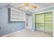 This bedroom features custom built-in shelving, a closet, and cool blue walls at 206 W Stoneybrook Ct, Benson, NC 27504