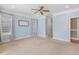 Large bedroom with carpet, ceiling fan, and neutral paint offers a serene and relaxing ambiance at 206 W Stoneybrook Ct, Benson, NC 27504