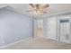 This bedroom features carpet, neutral paint, and doors that lead to the hallway at 206 W Stoneybrook Ct, Benson, NC 27504