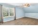 Bright bedroom with laminate flooring, window and a ceiling fan at 206 W Stoneybrook Ct, Benson, NC 27504