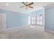 Light filled bedroom with carpet and many windows allowing natural light at 206 W Stoneybrook Ct, Benson, NC 27504