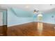 Large bonus room boasts hardwood floors, arched windows, and neutral paint at 206 W Stoneybrook Ct, Benson, NC 27504