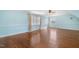 Bright bonus room featuring two windows, hardwood floors, and neutral-toned walls creates a welcoming and versatile living space at 206 W Stoneybrook Ct, Benson, NC 27504