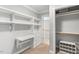 Custom closet with built-in desk, drawers, shelves, and hanging storage at 206 W Stoneybrook Ct, Benson, NC 27504