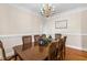 Traditional dining room with hardwood floors, ornate chandelier, and space for large gatherings at 206 W Stoneybrook Ct, Benson, NC 27504