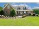 Charming two-story brick home with a manicured lawn and inviting front porch at 206 W Stoneybrook Ct, Benson, NC 27504