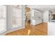 Bright eat-in kitchen with hardwood floors, large windows, and ample cabinet space at 206 W Stoneybrook Ct, Benson, NC 27504