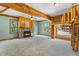 A spacious living room with a stone fireplace and a rustic wooden spiral staircase at 206 W Stoneybrook Ct, Benson, NC 27504