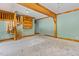 Rustic living room featuring a unique spiral staircase and natural wooden beams at 206 W Stoneybrook Ct, Benson, NC 27504