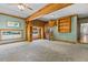 Bright living room with rustic spiral staircase and large windows at 206 W Stoneybrook Ct, Benson, NC 27504