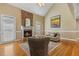 Inviting living room with brick fireplace, traditional design and natural light at 206 W Stoneybrook Ct, Benson, NC 27504