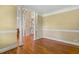Spacious living room with hardwood floors, white columns, and ample natural light at 206 W Stoneybrook Ct, Benson, NC 27504