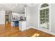 Bright living space with hardwood floors and arched windows overlooking lush greenery at 206 W Stoneybrook Ct, Benson, NC 27504