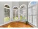 Bright, sunny room featuring three arched windows overlooking a verdant lawn at 206 W Stoneybrook Ct, Benson, NC 27504