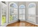 Bright, sunny room featuring three arched windows overlooking a verdant lawn at 206 W Stoneybrook Ct, Benson, NC 27504