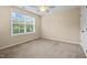 Bedroom with neutral carpet, ceiling fan, and a window at 210 Strolling Way, Durham, NC 27707