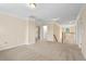 Spacious bonus room with multiple doorways, neutral carpeting, and overhead lighting at 210 Strolling Way, Durham, NC 27707