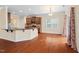 Open-concept kitchen with granite countertops, hardwood floors, and modern appliances at 210 Strolling Way, Durham, NC 27707