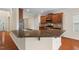 Gourmet kitchen with granite countertops, stainless steel appliances, and breakfast bar at 210 Strolling Way, Durham, NC 27707