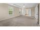 Spacious main bedroom boasts tray ceiling, ensuite entrance, and lots of natural light at 210 Strolling Way, Durham, NC 27707