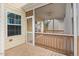 Outside screened porch with ceiling fan and doorway entry at 210 Strolling Way, Durham, NC 27707
