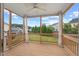 Relaxing screened porch with ceiling fan overlooking the backyard at 210 Strolling Way, Durham, NC 27707