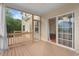 Covered porch looking into the home's interior through glass sliding doors at 210 Strolling Way, Durham, NC 27707